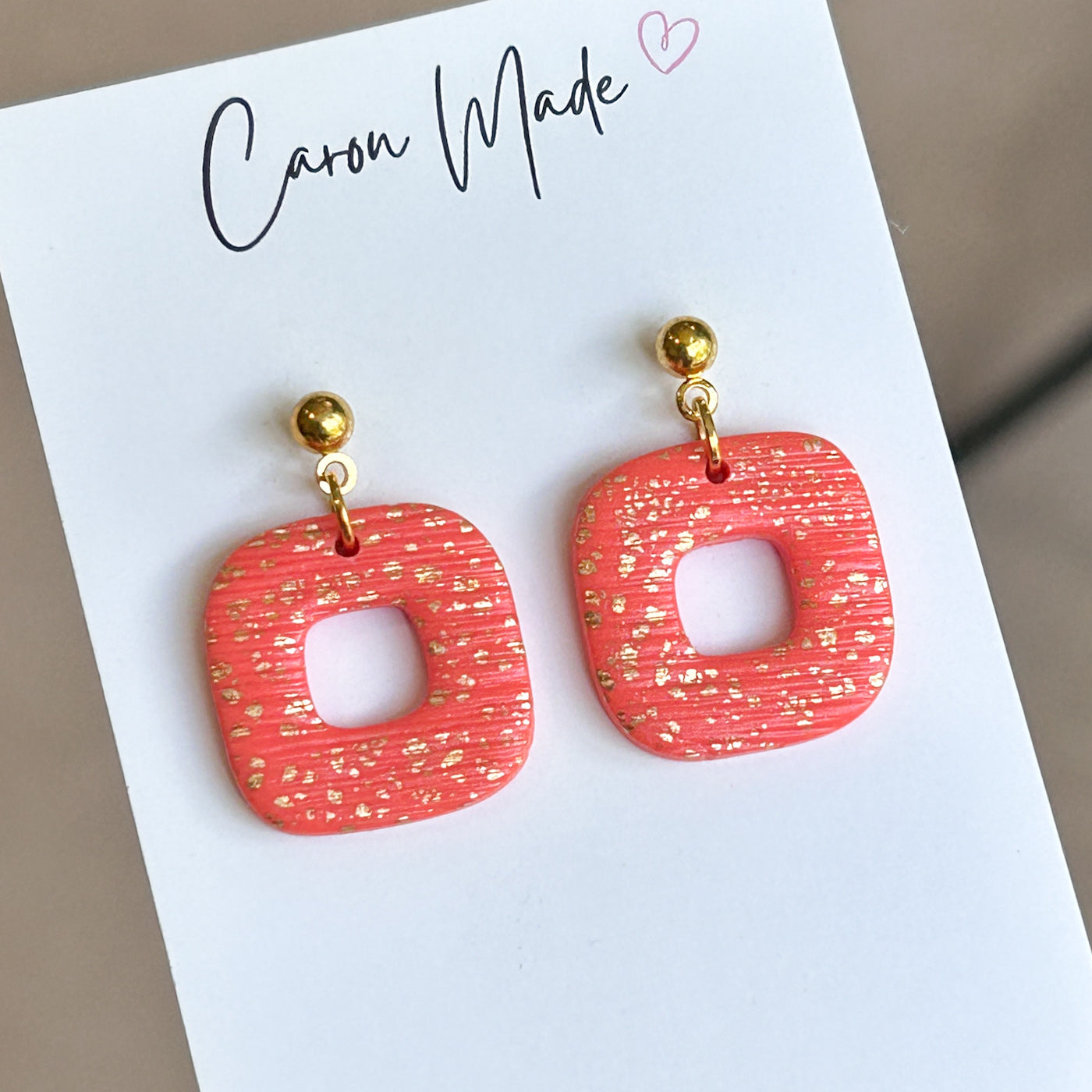 Coral and gold rounded square