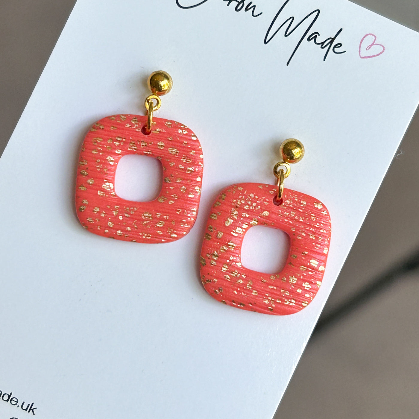 Coral and gold rounded square