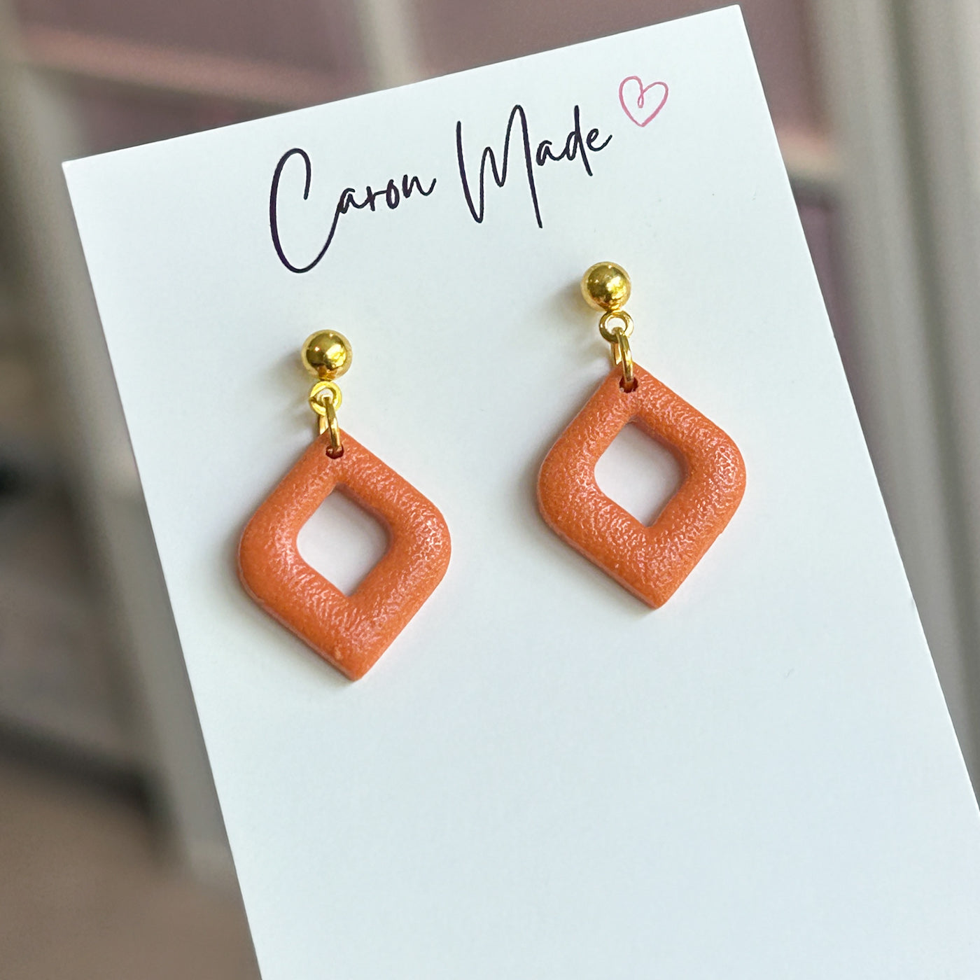 Small orange and gold earrings