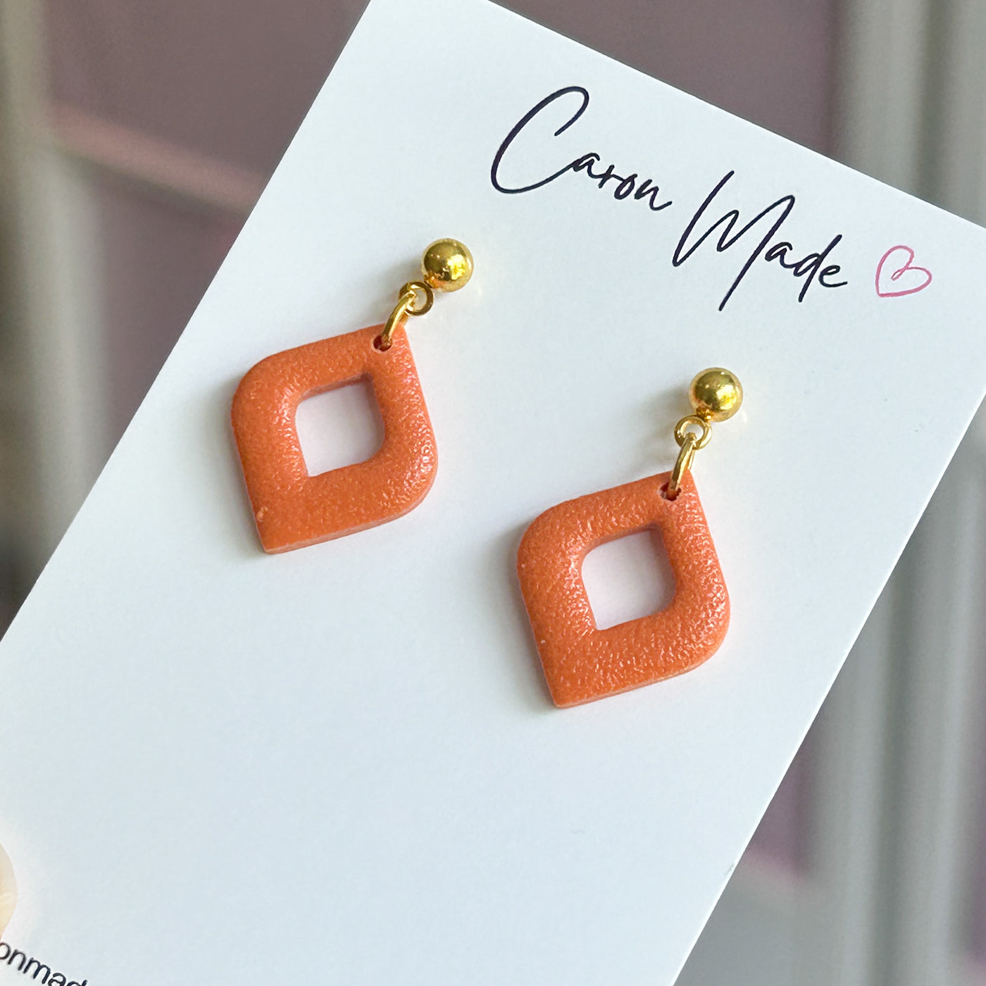 Small orange and gold earrings