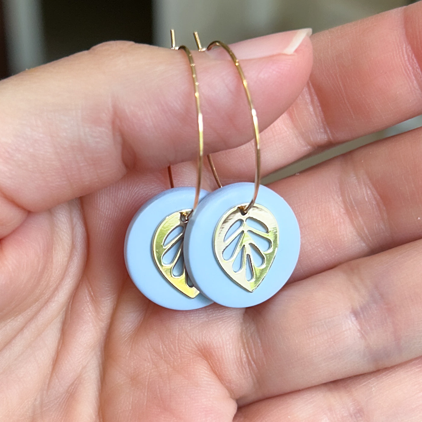 Hoop earrings with blue clay and leaf charm