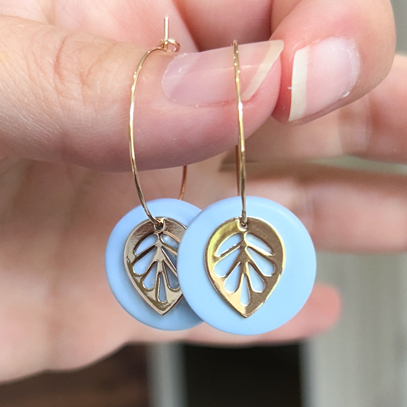 Hoop earrings with blue clay and leaf charm