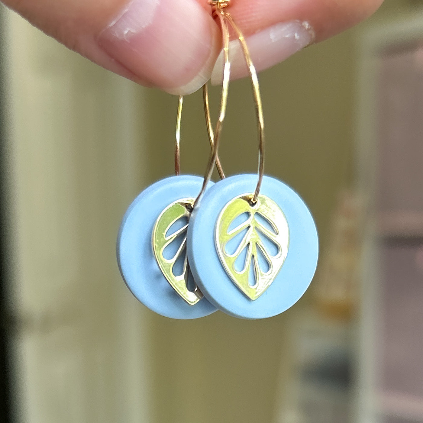 Hoop earrings with blue clay and leaf charm