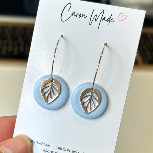 Hoop earrings with blue clay and leaf charm