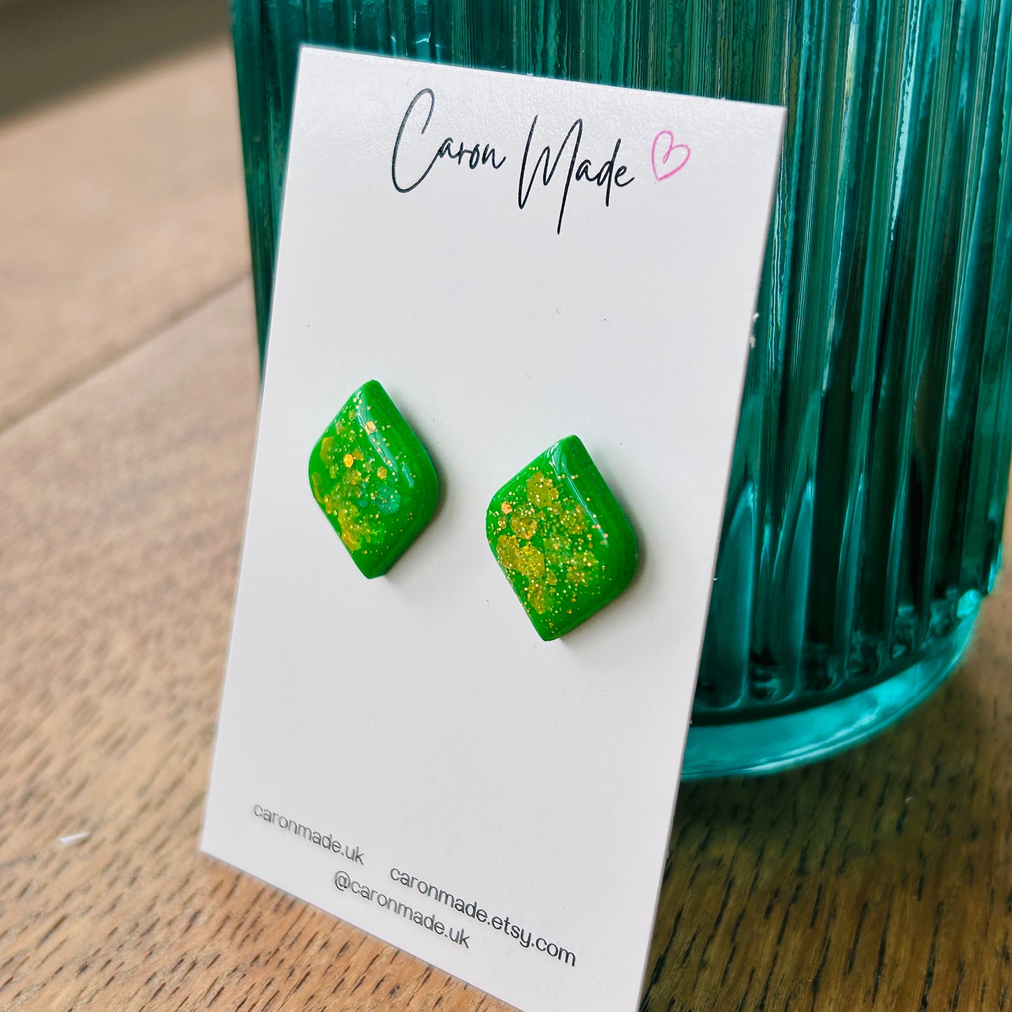 Bright green stud earrings with glitter