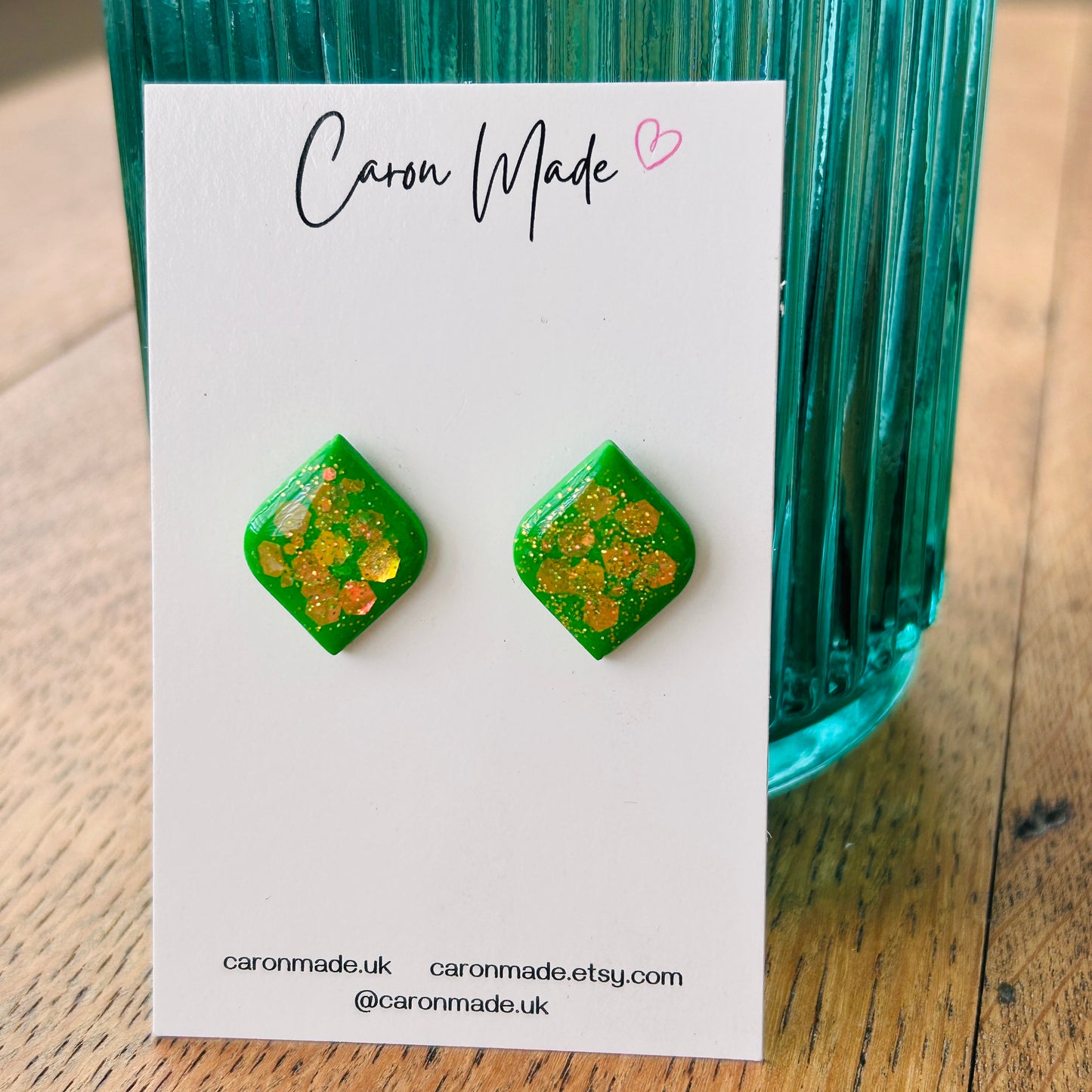 Bright green stud earrings with glitter