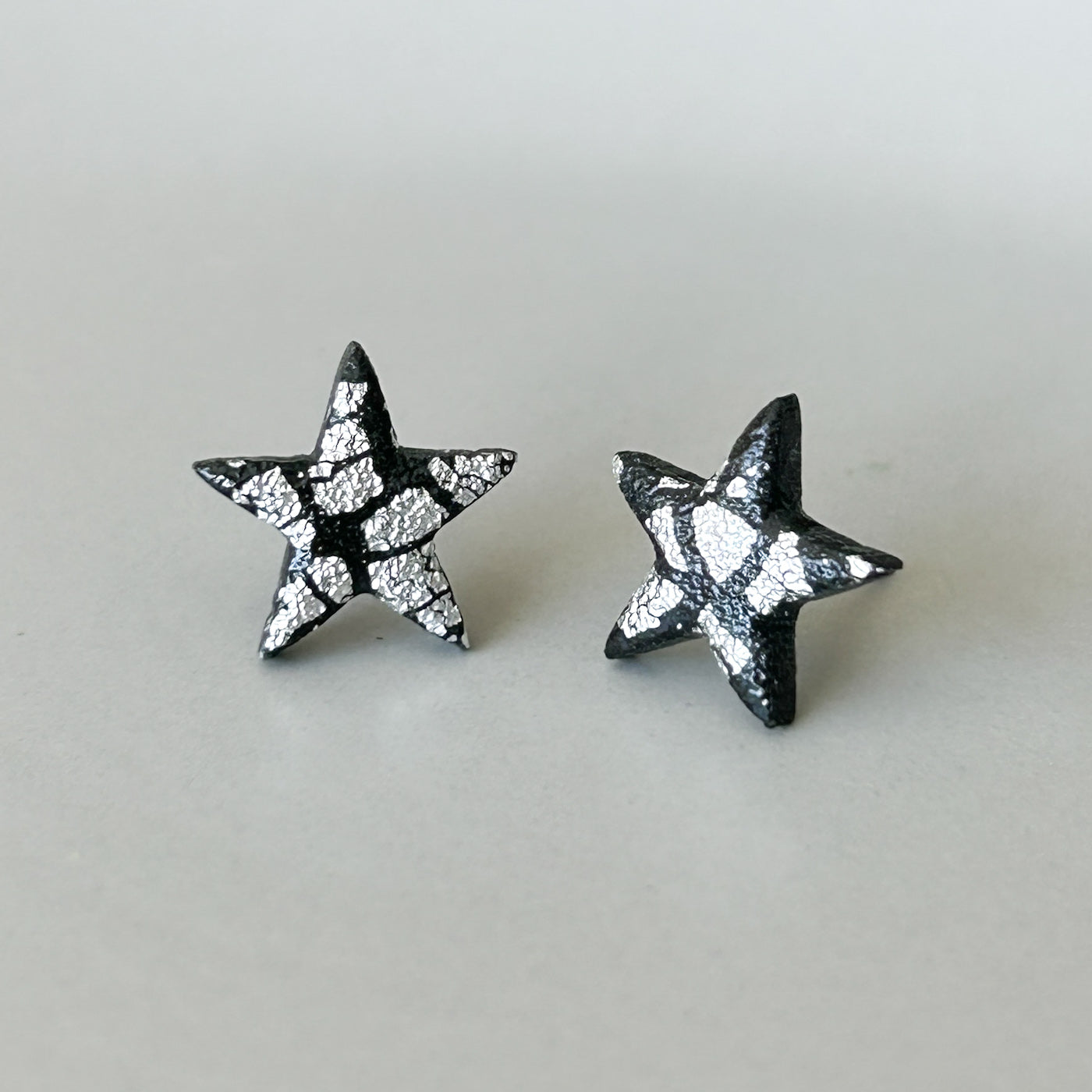 Star stud earrings, black & silver, hypoallergenic steel posts