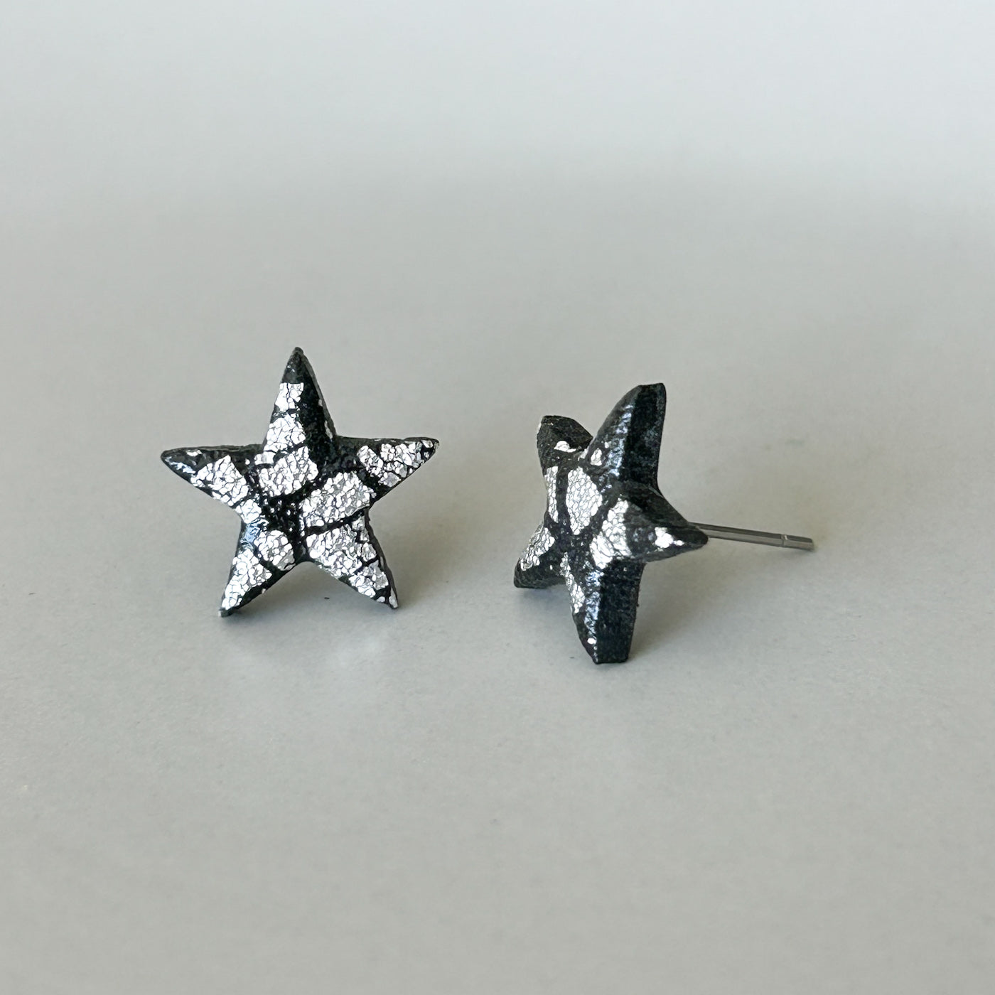 Star stud earrings, black & silver, hypoallergenic steel posts